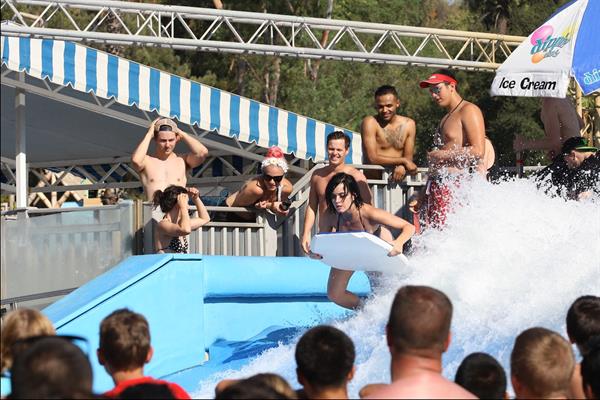 Katy Perry talks with a group of her friends after spending the afternoon at Raging Waters in San Dimas, California on August 12, 2012