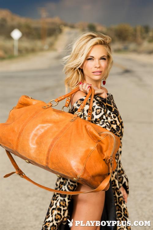 Playboy Cybergirl - Dani Mathers poses naked on a classic car