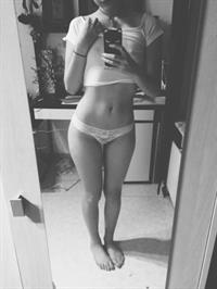 Anonymous in lingerie taking a selfie