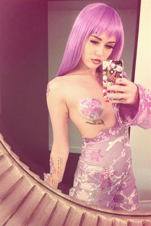 Miley Cyrus as Lil' Kim for Halloween