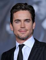 Matt Bomer in a suit with a few days of stubble