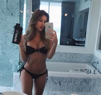 Cindy Prado in a bikini taking a selfie