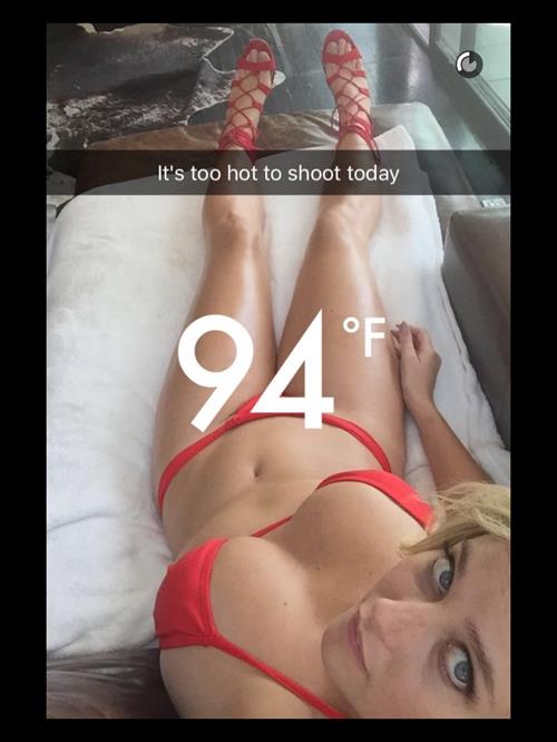 Genevieve Morton in a bikini taking a selfie