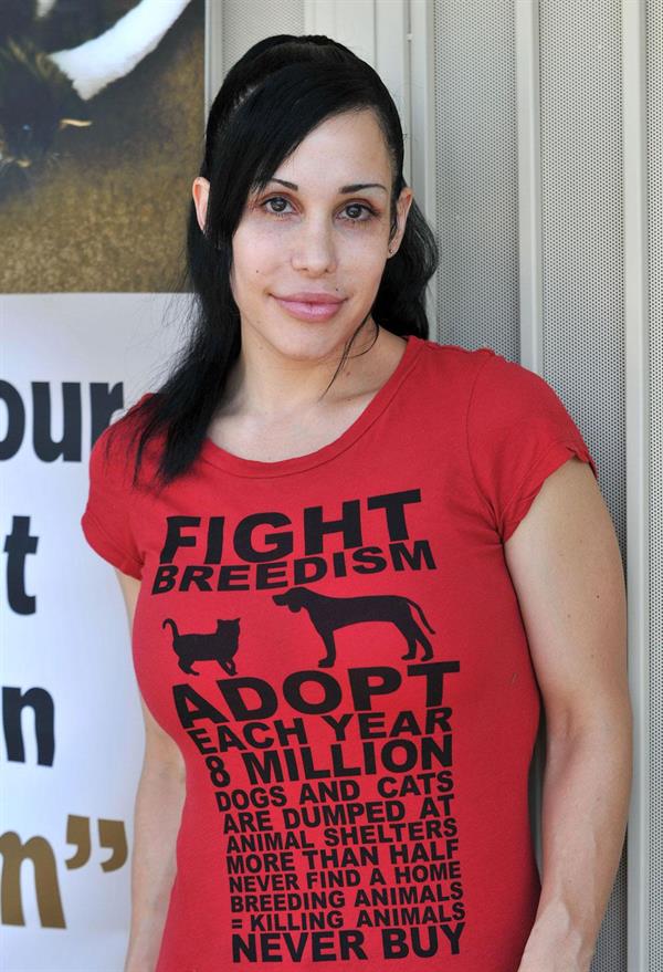 Nadya Suleman is better known as Octomom.  She was born Natalie Denise Suleman on July 11, 1975.  After 14 children she is stripping and making porn...

Her shirt says,  Fight Breedism , which is kind of ironic