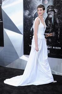 Catwoman Anne Hathaway in a Prabal Gurung gown cut her hair short for the Dark Knight Rises.  This was at the New York premiere.

 I've now done back-flips out of windows, I've jumped off buildings,  she said.  And cutting my hair reduced me to, like, mental patient-level crying.  

There is a Dark Knight Rises poster in the background