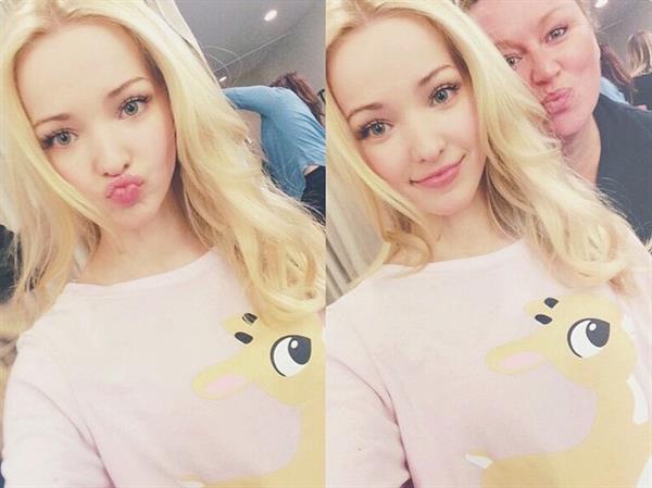 Dove Cameron taking a selfie