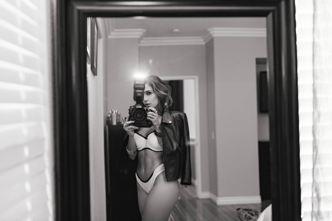 Tianna Gregory in a bikini taking a selfie