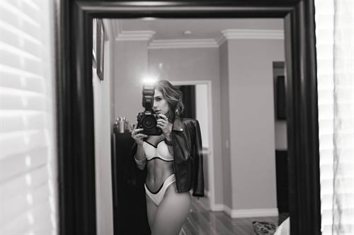 Tianna Gregory in a bikini taking a selfie