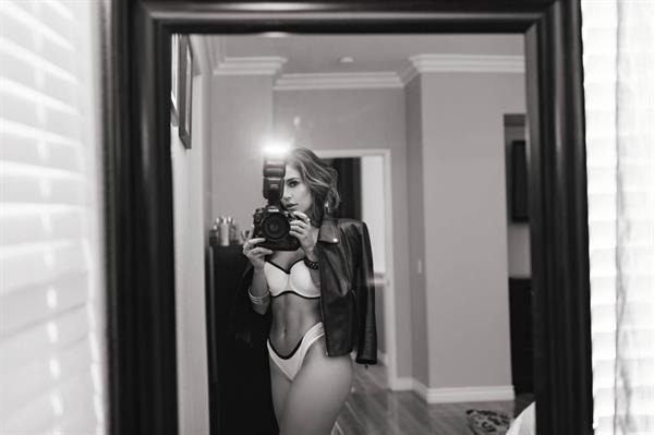 Tianna Gregory in a bikini taking a selfie