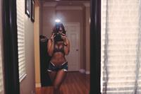 Tianna Gregory in a bikini taking a selfie