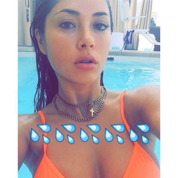 Arianny Celeste in a bikini taking a selfie