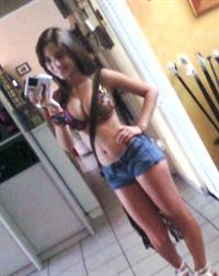 Angie Varona in a bikini taking a selfie