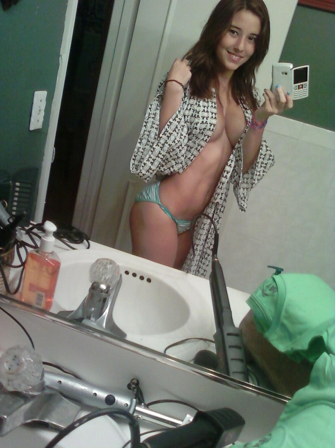 Angie Varona in a bikini taking a selfie