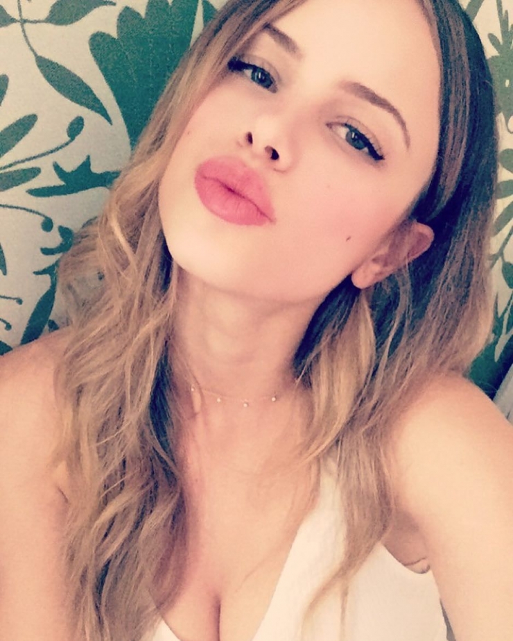 Halston Sage taking a selfie