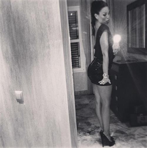 Nicole Minetti taking a selfie