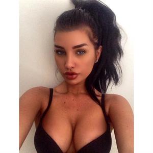 Ann Denise in a bikini taking a selfie