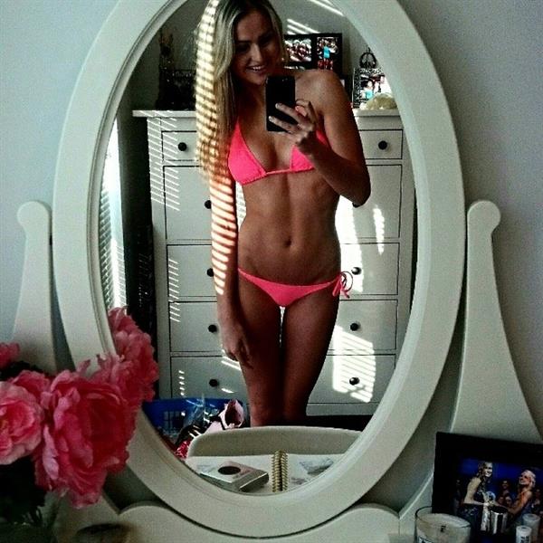 Mackenzie White in a bikini taking a selfie