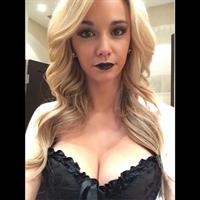 Caitlin Arnett in lingerie taking a selfie