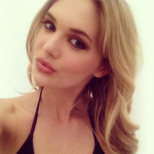 Megan Williams in a bikini taking a selfie
