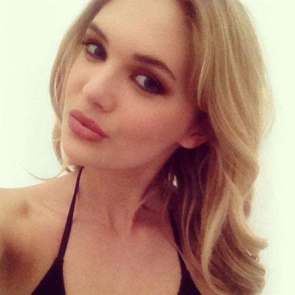 Megan Williams in a bikini taking a selfie