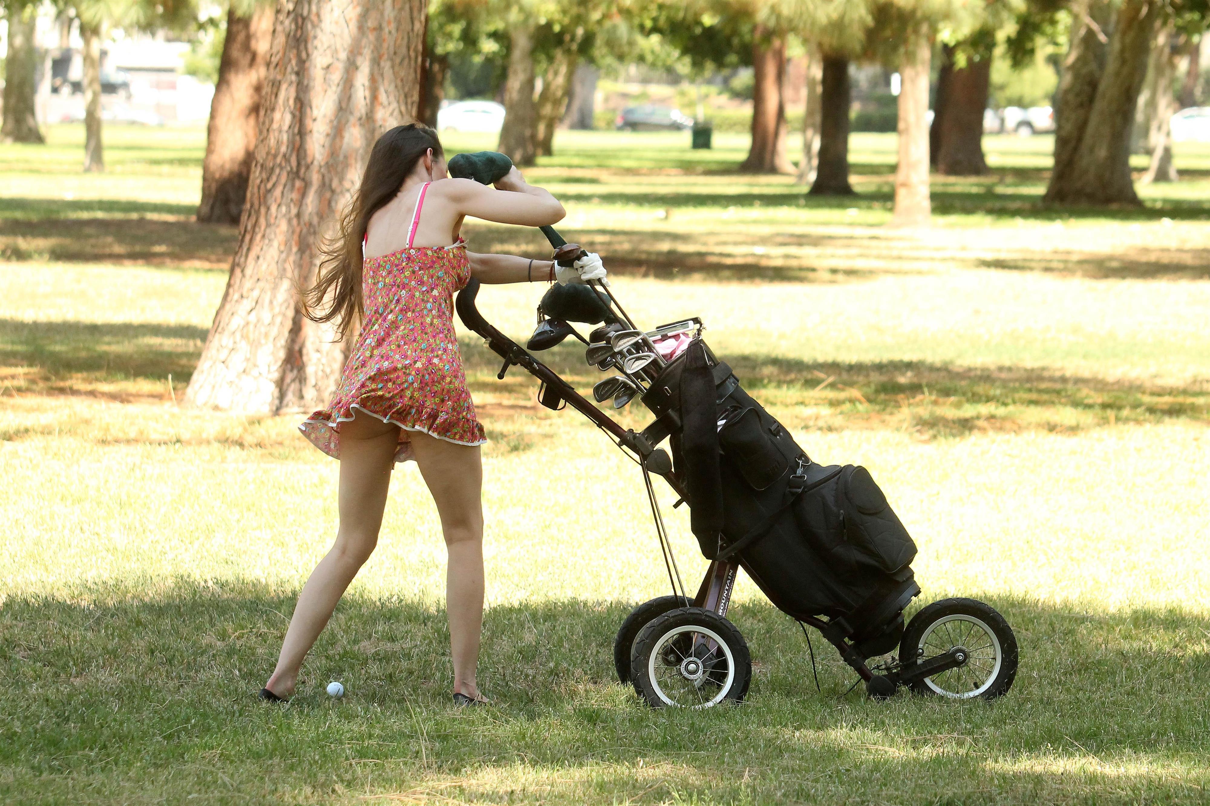 Alicia Arden golfing in a tiny skirt.  Upskirt pink panties.