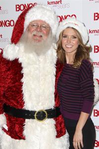 Audrina Patridge poses with Santa Claus