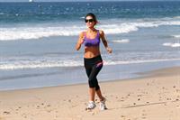 Audrina Patridge running on the beach in the South Bay