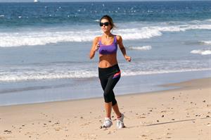 Audrina Patridge running on the beach in the South Bay