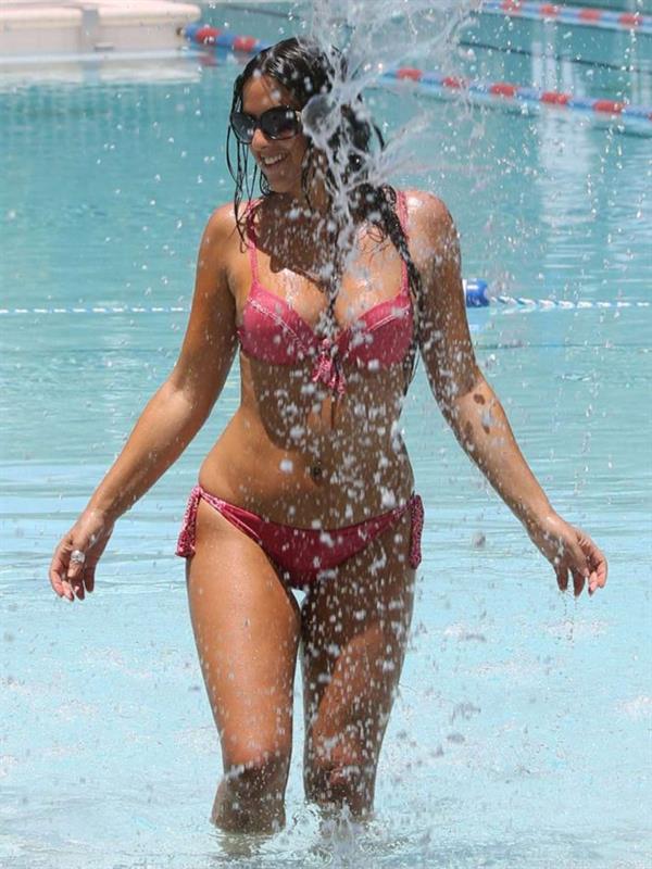 Claudia Romani takes a dip in a pool