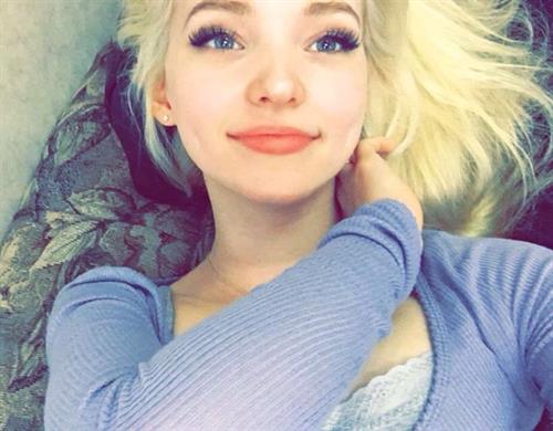 Dove Cameron taking a selfie
