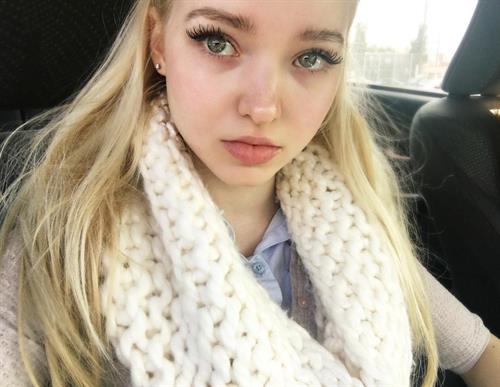 Dove Cameron taking a selfie