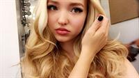 Dove Cameron taking a selfie