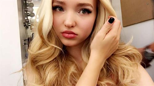 Dove Cameron taking a selfie