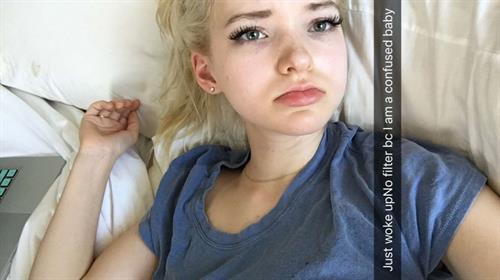 Dove Cameron taking a selfie