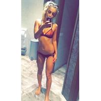 Tiffany Watson in a bikini taking a selfie