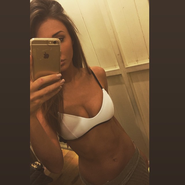 Megan McKenna in a bikini taking a selfie