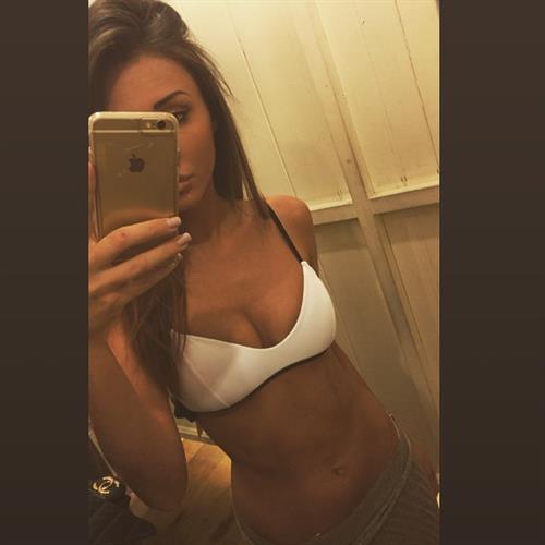 Megan McKenna in a bikini taking a selfie