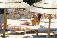 Aida Yespica - Yellow bikini candids in Sardinia on June 18, 2012