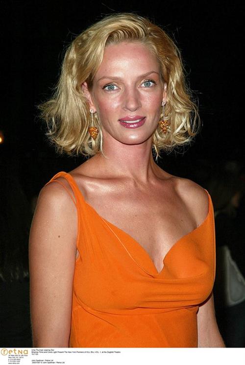 Uma Thurman in an orange dress