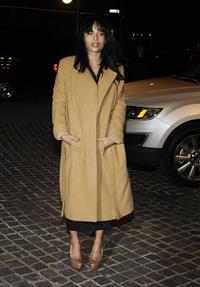 Zoe Kravitz in a long jacket and high heels