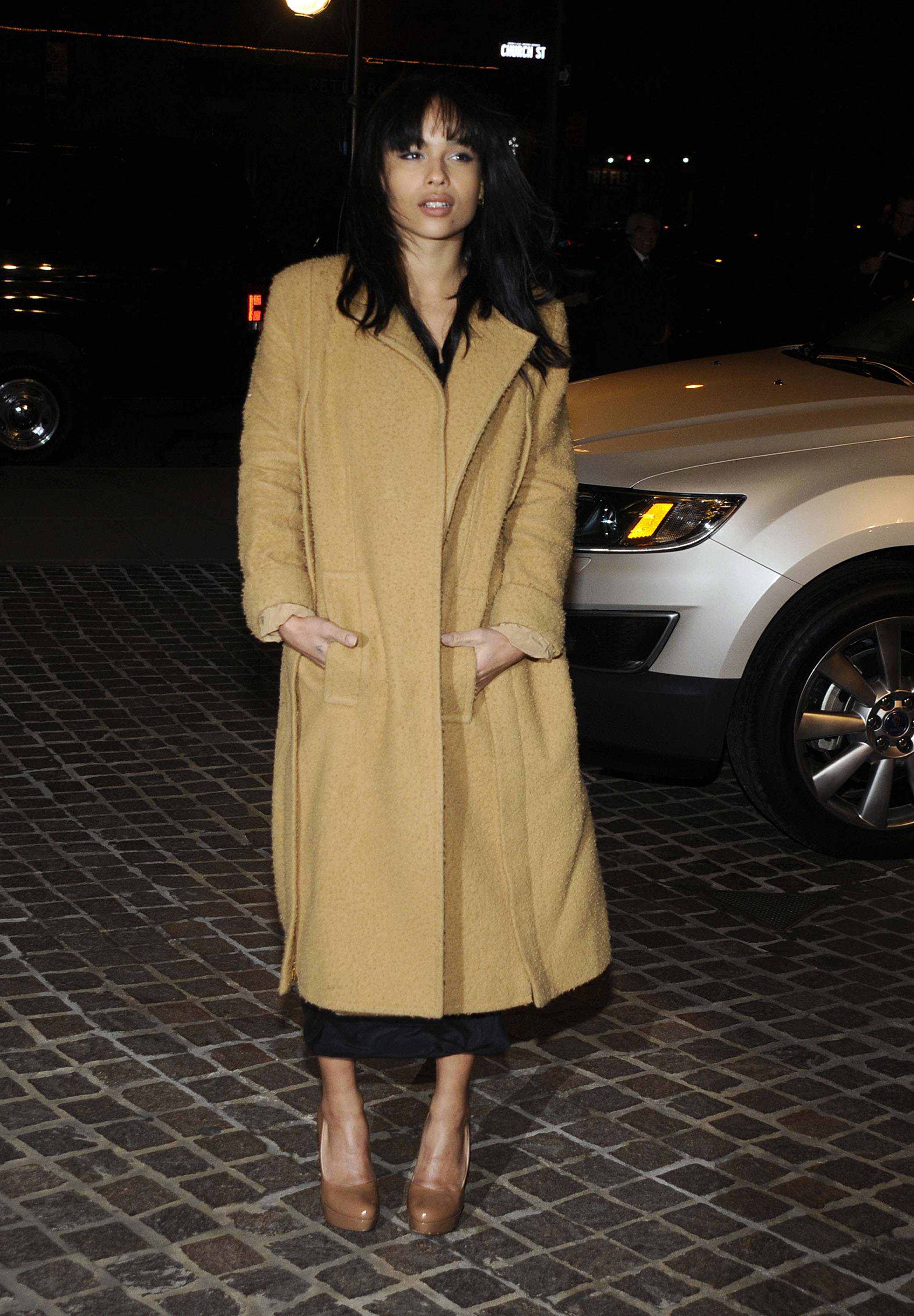 Zoe Kravitz in a long jacket and high heels