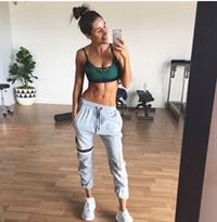 Kayla Itsines taking a selfie