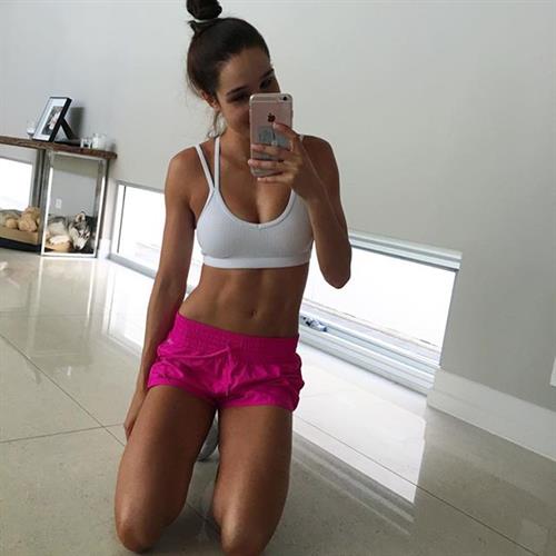 Kayla Itsines taking a selfie