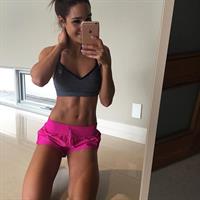 Kayla Itsines taking a selfie