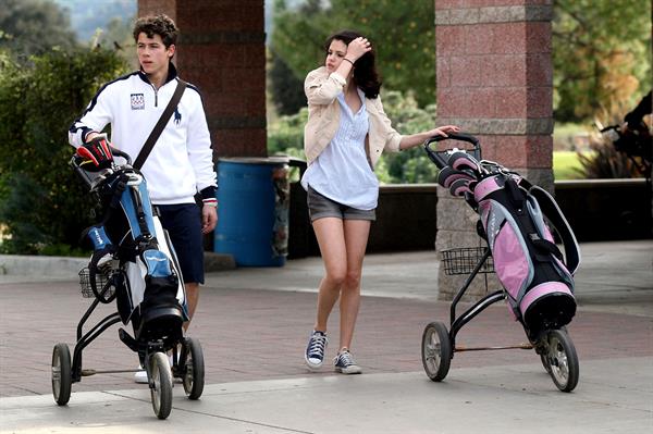 Selena Gomez golfing on February 2, 2010