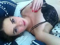 Alexis Young in lingerie taking a selfie