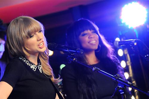 Taylor Swift performs at a private concert for NRJ on a barge on The Seine January 28, 2013 
