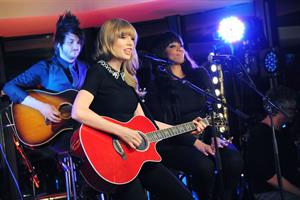 Taylor Swift performs at a private concert for NRJ on a barge on The Seine January 28, 2013 