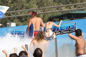 Katy Perry talks with a group of her friends after spending the afternoon at Raging Waters in San Dimas, California on August 12, 2012