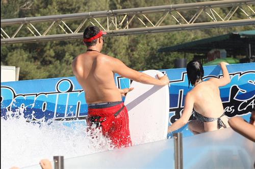Katy Perry talks with a group of her friends after spending the afternoon at Raging Waters in San Dimas, California on August 12, 2012